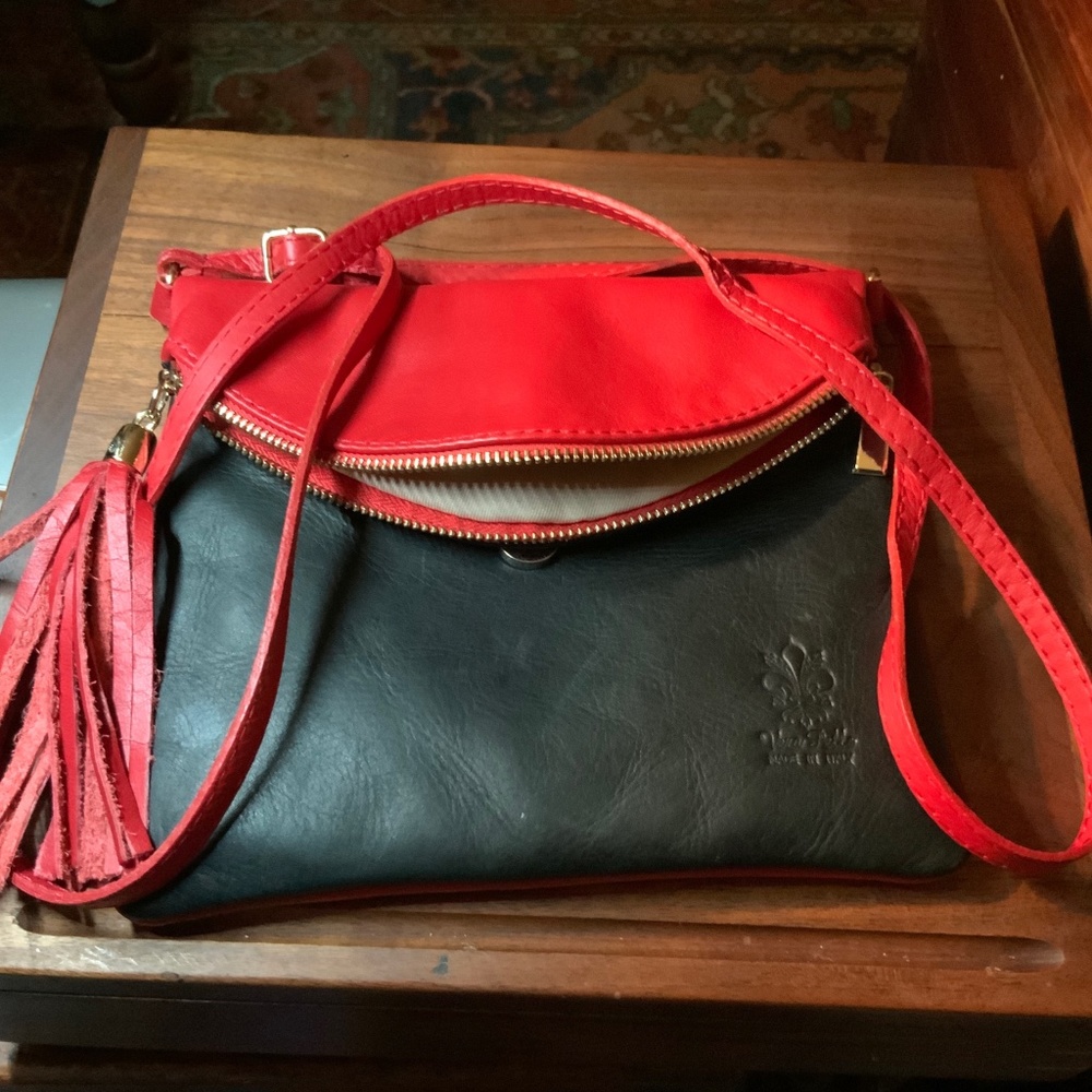 Vera Pelle Italian made,  black-red leather w leather tassel. Gold hardware